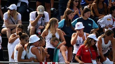 Distressed fans and teammates after Anita Alvarez had to be rescued from the pool after fainting. AP