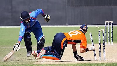 Afghanistan's Noor Ali is run out by Netherlands wicketkeeper Atse Buurman.