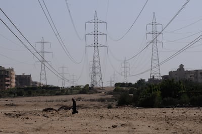 Power lines bring electricity to a community in Sixth of October city in Egypt. Photo: Dana Smillie for The National