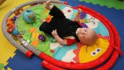Three-month old Samuel, above, was delivered by a community obstetrician. Below, Claire McInnes holds Samuel shortly after his birth.
