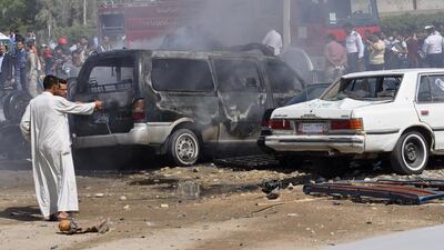 The site of a bomb attack in Nasiriyah, 375 kilometres south of Baghdad. The attack was one of 14 bombings yesterday. Reuters
