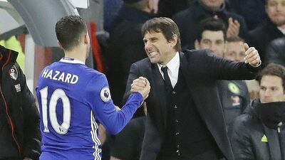 Eden Hazard is greeted by Antonio Conte after being substituted. Frank Augstein / AP Photo