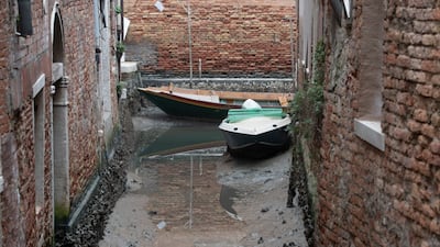 Some of Venice's secondary canals are running dry after a prolonged spell of low tides linked to a lingering high-pressure weather system