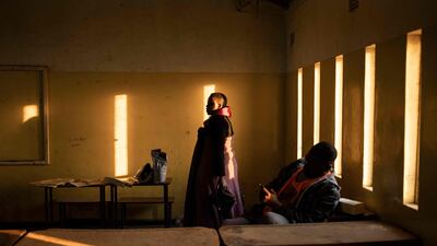 Officers from the Electoral Commission of Zambia take a break during ballot counting at a polling station in Lusaka. The presidential and legislative elections are seen as a test of the country's democratic credentials after a tense campaign dominated by economic woes and a debt crisis.
