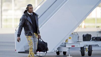 Carolina Panthers' Cam Newton gets off the plane at the Mineta San Jose International Airport as they arrive for Super Bowl 50. The Panthers play the Denver Broncos on Sunday, Feb. 7, 2015. (AP Photo/Charlie Riedel)