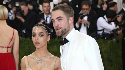 Taking it up a notch in a white tux jacket, Robert Pattinson arrives with FKA Twigs for the 2016 Costume Institute Benefit at The Metropolitan Museum of Art on May, 2 2016. EPA