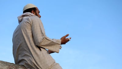 A Muslim pilgrim prays at Jabal Al Noor 'mountain of light' in Makkah, Saudi Arabia. AFP