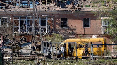 Civilian road transport damaged beyond repair by Russian attacks on Kyiv. AFP