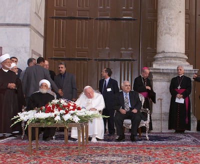 Syria’s Mufti Sheikh Ahmad Kuftaro meets Pope John Paul II – a strong advocate of better relations between Christianity and Islam – at the Omayyad mosque compound in Damascus in 2001. It was the first time a Pope had set foot inside a mosque. AP