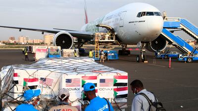 Aid workers in Sudan check a shipment of vaccines in October 2021. African countries complained of unequal access after rich countries hoarded shots against Covid-19. AFP