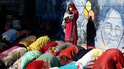 Women perform Eid Al Fitr prayers in Rome. AP