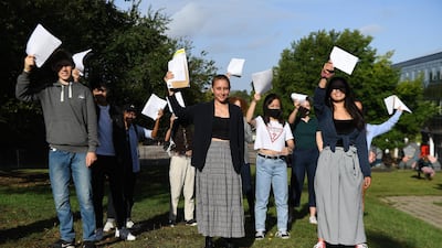 Secondary school students with their GCSE results at Kingsdale Foundation school in south London, Britain, 20 August. Andy Rain / EPA
