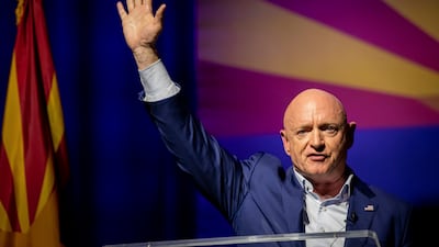 Mark Kelly, a Democratic incumbent senator from Arizona, waves to supporters on election night. AP