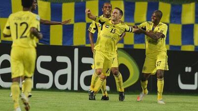 Kalba players celebrate the first of Gregory Dufrennes’ goals against Al Dhafra at Madinat Zayed last night.