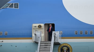 Mr Trump steps off of Air Force One on arrival at Joint Base Elmendorf-Richardson in Anchorage. AFP