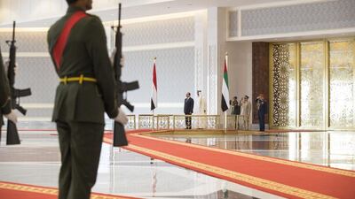 Sheikh Mohamed bin Zayed, Crown Prince of Abu Dhabi and Deputy Supreme Commander of the Armed Forces, and Abdel Fattah El Sisi, President of Egypt, stand for the national anthem during a reception at the Presidential Airport. Ryan Carter / Crown Prince Court - Abu Dhabi