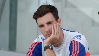 Steven Finn of England speaks to team doctor Rob Young as he sits out a nets session at Zayed Cricket Stadium on October 12, 2015 in Abu Dhabi, United Arab Emirates. Gareth Copley / Getty Images