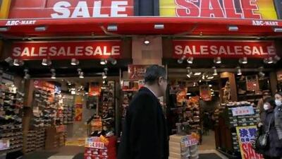 Sale signs displayed at a Tokyo shoe shop. Japan is in a state of deflation that the government wants to end. Toru Hanai / Reuters