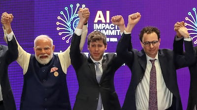 India's Prime Minister Narendra Modi poses with the chief executives of OpenAI and Anthropic at the AI Impact Summit in New Delhi. AFP