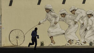 More than a dozen buildings along December 2 street have been transformed with murals. Christopher Pike / The National