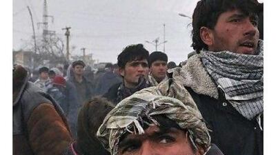 Stone-throwers at Bagram airbase demonstrate their rage over an incident of Quran-burning. Readers say that the US and allied military officers should have known better. MassoudHossaini / AFP