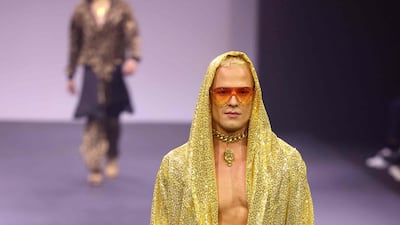 Billowing robes, capes, and trench-like jackets in glistening silk were the standouts.