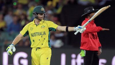 Australia's Steven Smith waves his bat as he celebrates scoring 50 runs against Pakistan in the Cricket World Cup quarter-final victory. James Elsby / AP / March 20, 2015