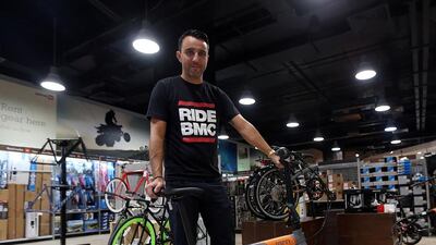 Alex Silva, a marketing coordinator at sports store Adventure HQ and keen cyclist, says proper clothing and having some spare parts at hand will make cycling a better experience. Satish Kumar / The National