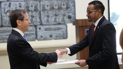 Somaliland ambassador Mohamed Hagi, right, presents his diplomatic credentials to Israeli President Isaac Herzog, in Jerusalem. EPA