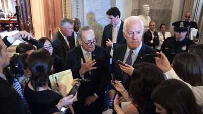 Democratic senator Charles "Chuck" Schumer (centre-left) and Republican senator John Cornyn (centre-right), the co-authors of the Jasta bill, speak to reporters following the Senate override vote on September 28, 2016. Shawn Thew/EPA
