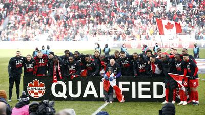Canada celebrate after beating Jamaica to qualify for the 2022 World Cup. AFP