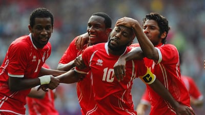 Ismail Matar of the UAE celebrates scoring with teammates Abdulaziz Hussain, Ahmed Khalil and Rashed Eisa. Getty Images