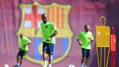 Dani Alves of Barcelona passes the ball during a drill on Tuesday ahead of Saturday's Champions League final against Juventus. David Ramos / Getty Images