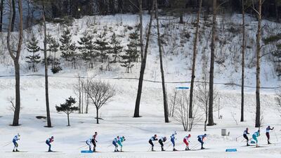 Athletes compete in the men's 50km mass start classic cross-country skiing at the 2018 Winter Olympics. Toby Melville / Reuters
