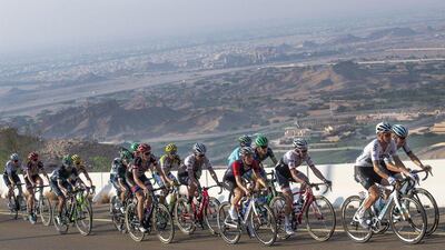 The pack make their way up Jebel Hafeet mountain in Al Ain during Stage 3. Luca Zennaro / EPA