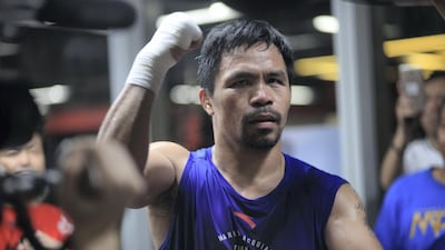 Manny Pacquiao works on a punchbag. Jake Verzosa for The National