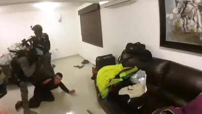 Screen grab from a handout video taken on January 8, 2016 and released by the Mexican Navy showing marines assaulting a house and capturing a foe during the operation to recapture Mexico’s most wanted drug kingpin, Joaquin “El Chapo Guzman” Guzman in Los Mochis, Mexico. AFP / Marina De Mexico