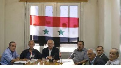 Leading Syrian dissidents, including Hussein al Oudat, left, Hasan Abdul Azeem, third from left, and Aref Dalila, far right, launch the National Coordination Committee in Damascus yesterday. Phil Sands/The National