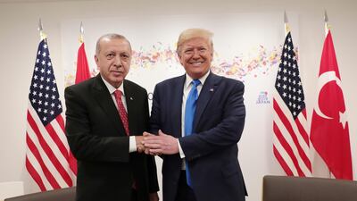 Turkey's President Recep Tayyip Erdogan and US President Donald Trump meet on the sidelines of the G20 summit in Osaka, Japan, on June 29, 2019. Presidential Press Service via AP
