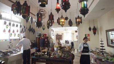 Most people tip in cash at Cafe Arabia, in Abu Dhabi, according to manger Ia Iluridze. Ravindranath K / The National