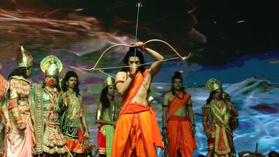 An artist dressed as Hindu deity Ram performs the 'Ramlila' along with other actors. EPA