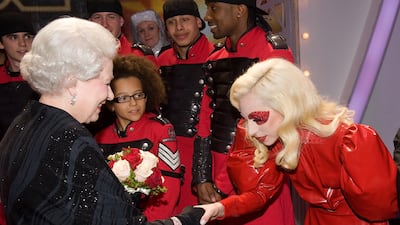 She shakes hands with US singer Lady Gaga in Blackpool, England. Getty