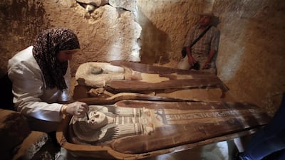 epaselect epa07546584 An Egyptian archaeologist works on a sarcophagus at the site of an ancient an old Kingdom cemetery that was uncovered at the south-eastern side of Giza Plateau, Giza, Egypt, 04 May 2019. An Egyptian Archaeological Mission discovered part of an Old Kingdom cemetery during excavations carried out at the south-eastern side of Giza Plateau. The team uncovered several Old Kingdom tombs and burial shafts but the oldest one to be discovered is a limestone family tomb from the fifth dynasty (circa 2500 B.C.) which retains some of its inscriptions and scenes. EPA/KHALED ELFIQI