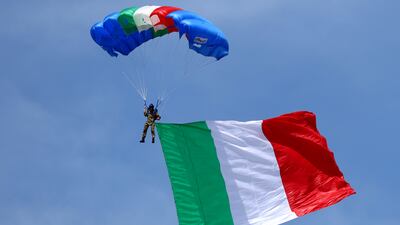 A parachutist arrives flying the Italian flag at the start of the F1 Grand Prix of Italy at Autodromo Nazionale Monza. Getty Images