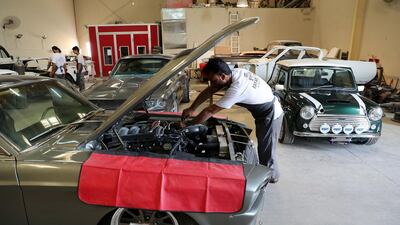 A mechanic working in Rayans Rides' workshop in Sharjah. Pawan Singh / The National