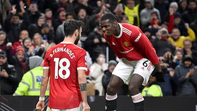 Manchester United's Bruno Fernandes celebrates with Paul Pogba after scoring his side's second goal against Brighton at Old Trafford in February, 2022, Reuters
