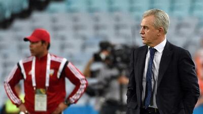Japan coach Javier Aguirre, right, looks on during the Asian Cup quarter-final against the UAE. Saeed Khan/AFP