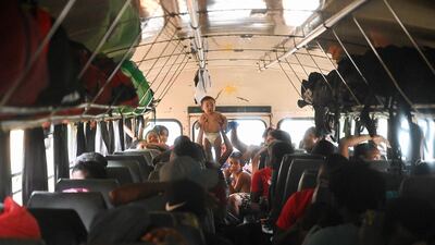 Migrants heading to the US on board a bus heading towards the US-Mexico border. EPA