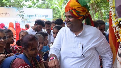 Shyam Sunder Paliwal seen with villagers as they celebrate 'Raksha Bandhan' by tying rakhi to plants. Prem Shankar