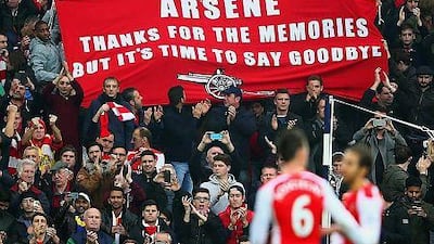 Arsenal fans hold up a banner for Arsene Wenger, manager of Arsenal during their Premier League match against West Bromwich Albion at The Hawthorns on November 29, 2014 in West Bromwich, England (Photo by Mark Thompson/Getty Images)